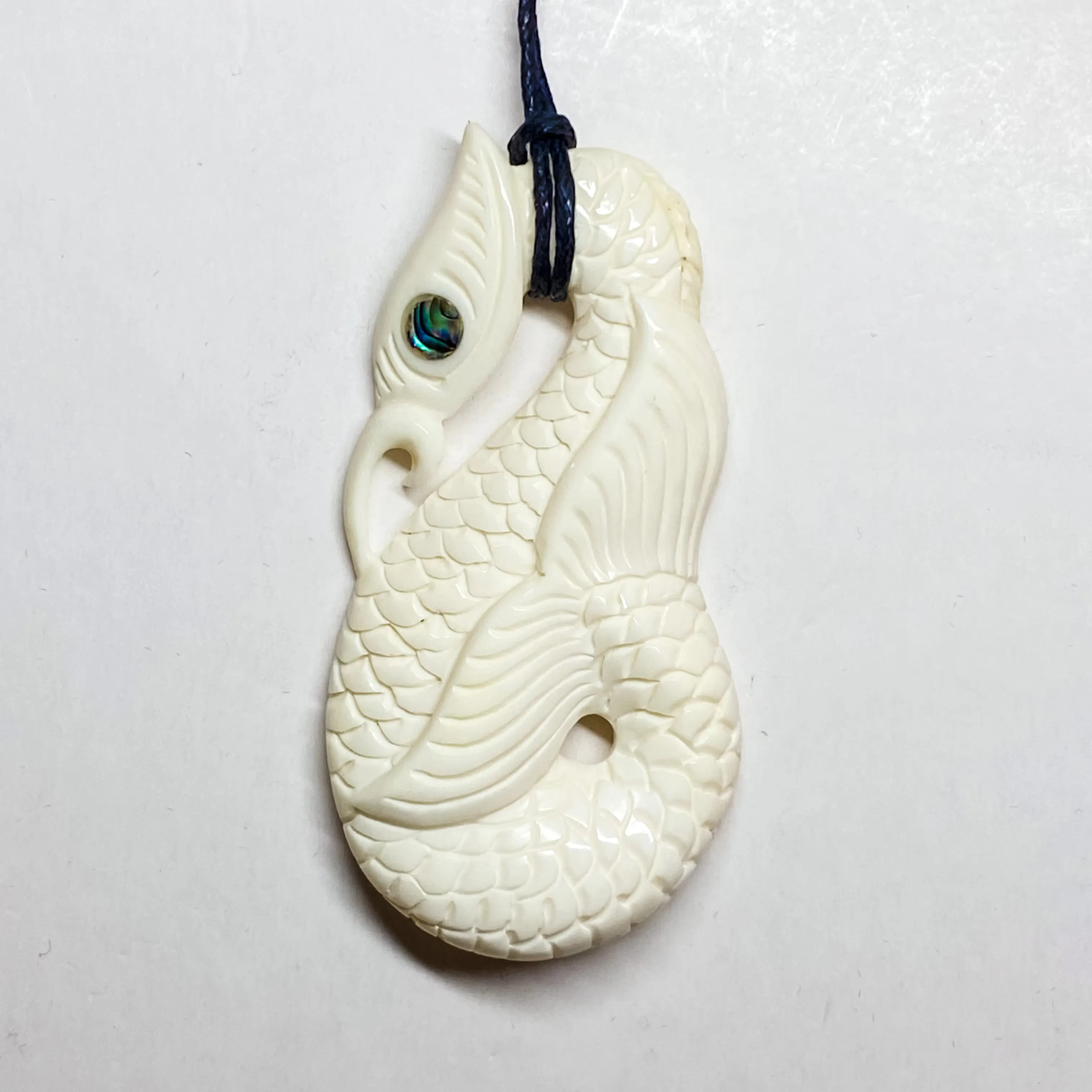 Handcarved Intricate Bone Carving Pendant w Paua Eye - Manaia